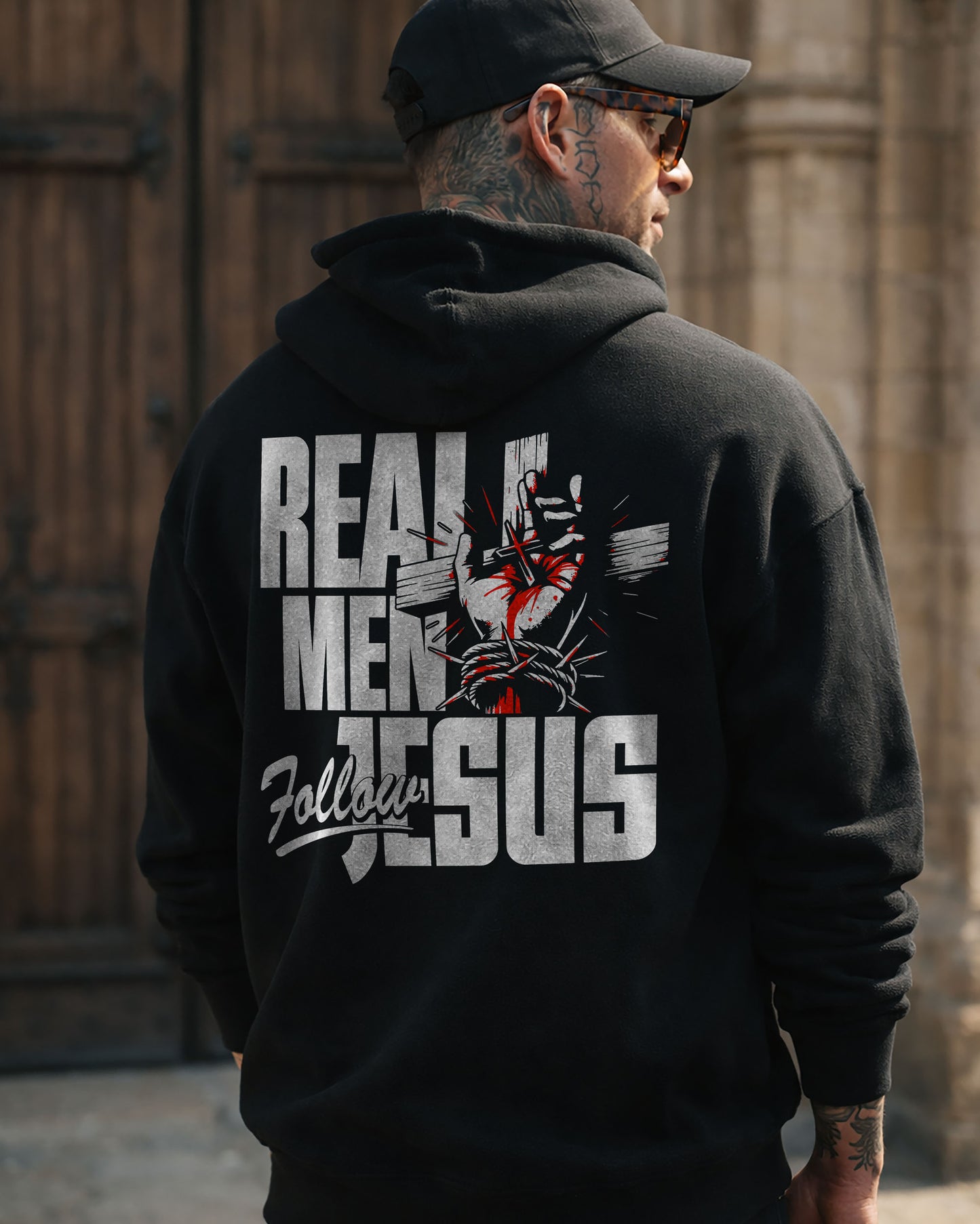 Real Men Follow Jesus Hoodie – Black
